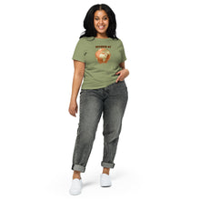 Load image into Gallery viewer, A woman wearing a green t-shirt with a Earth melting design and text "Diverse as Earth" standing outdoors.