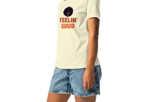 Load image into Gallery viewer, A woman wearing a pale yellow t-shirt with text, 'FEELIN GUUD with fluffy afro design on a white background