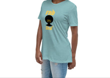 Load image into Gallery viewer, A woman wearing  a light-blue women's relaxed fit t-shirt with a crew neck and short sleeves, featuring the text 'FRO SHO' in yellow and black.