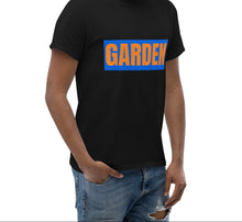 Load image into Gallery viewer, Man wearing a black t-shirt with 'GARDEN' printed in blue and orange on a white background