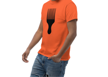 Load image into Gallery viewer, Man wearing an orange t-shirt with a black comb design on a white background
