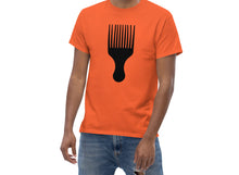 Load image into Gallery viewer, Man wearing a orange t-shirt with a black afro pick design on a white background
