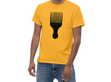 Load image into Gallery viewer, Yellow t-shirt with a black Afro pick design worn by a person on a white background