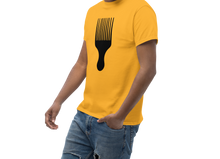 Load image into Gallery viewer, Man wearing a yellow t-shirt with a black comb design on a white background