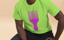 Load image into Gallery viewer, Man wearing a lime green t-shirt with a vivid pink afro pick design on a white background