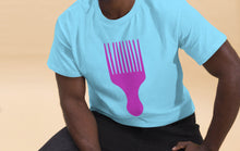 Load image into Gallery viewer, CU of Man wearing a light blue t-shirt with a pink comb graphic on a beige background