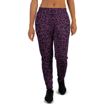 Load image into Gallery viewer, Purple leopard print jogger pants worn by a person no background