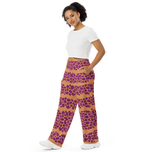 Load image into Gallery viewer, Woman wearing a pink leopard print  pattern on caramel pants on a white background