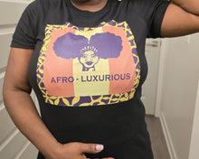 Load image into Gallery viewer, Person wearing a black t-shirt with colorful graphics and text, standing indoors.
