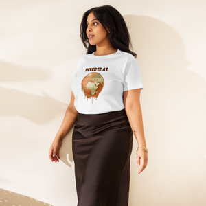 Woman wearing a white t-shirt with a Earth melting design and text "Diverse as Earth" standing indoors.