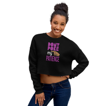 Load image into Gallery viewer, Woman wearing a black crop top with colorful text design, &#39;DON&#39;T POKE MY PATEIENCE&#39;.
