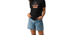 Woman wearing a black t-shirt with 'FEELIN' GUD' text and denim shorts on a white background