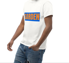 Load image into Gallery viewer, Man wearing a white t-shirt with a graphic design on a white background

