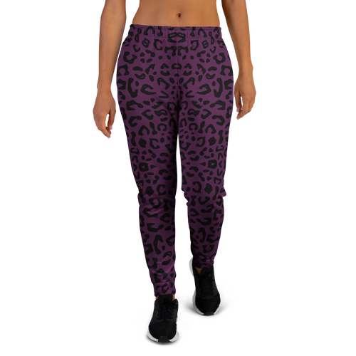 Purple leopard print jogger pants worn by a person no background