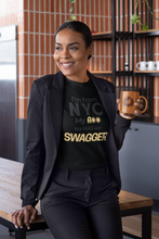 Load image into Gallery viewer, Woman holding a mug in a kitchen wearing a black t-shirt with text.
