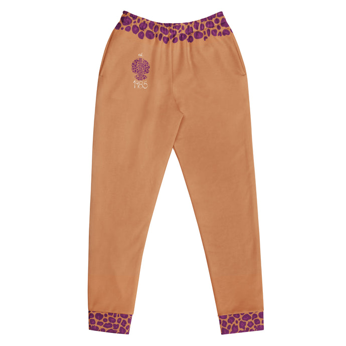 Caramel color pants with purple leopard print patterned waistband and cuffs on a white background